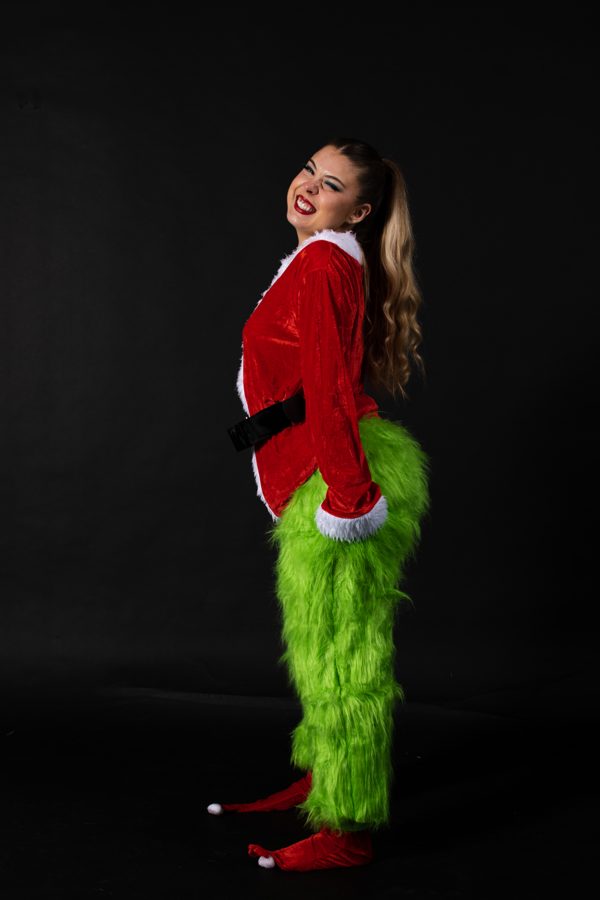 Grinch costume with santa jacket smiling