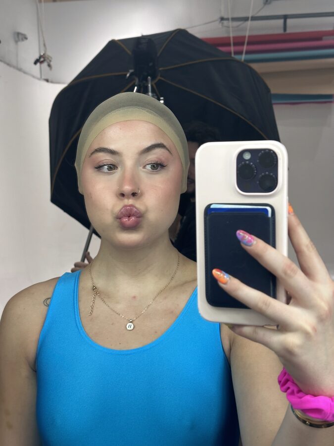Wig cap and umbrella light mirror selfie before the Barbie shoot