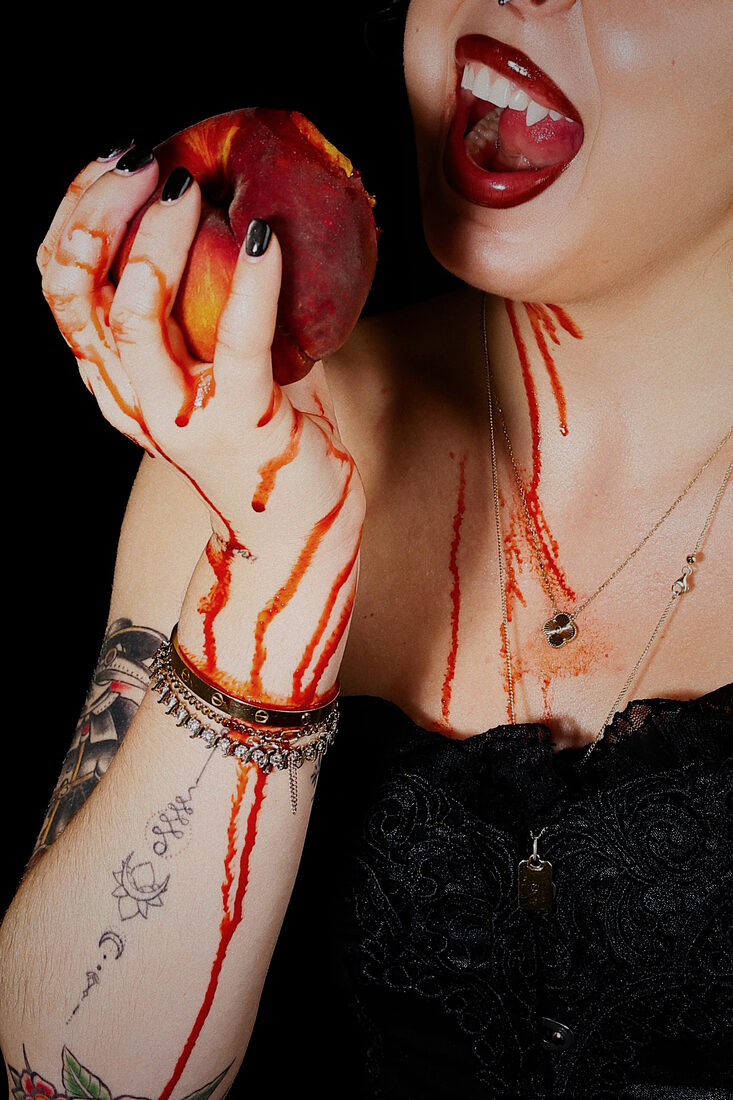 Vampire fangs and a peach for the Spooky Booty shoot